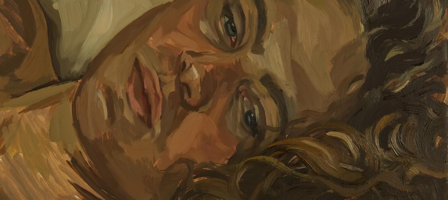 woman with brown curly hair laying down