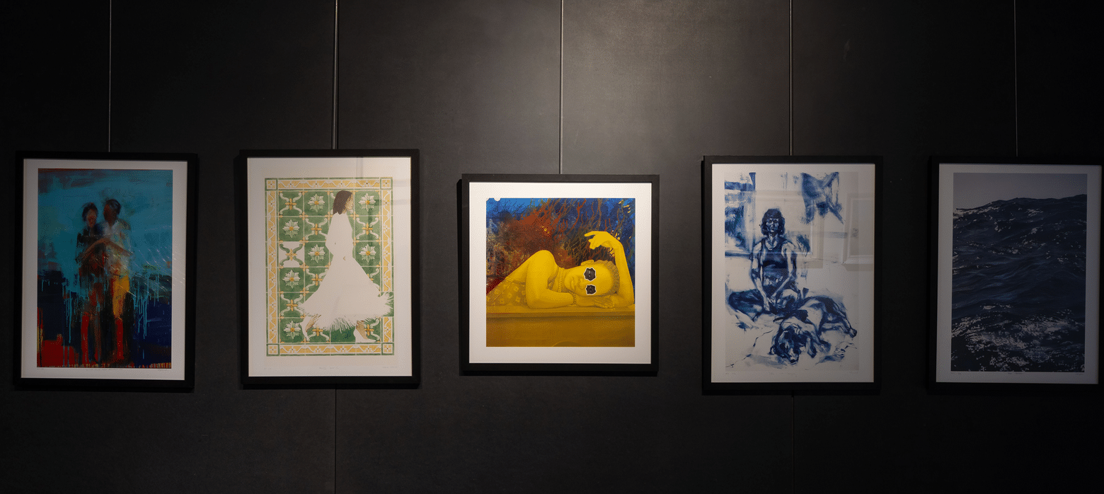 FBA editions first release prints hanging on a black wall 