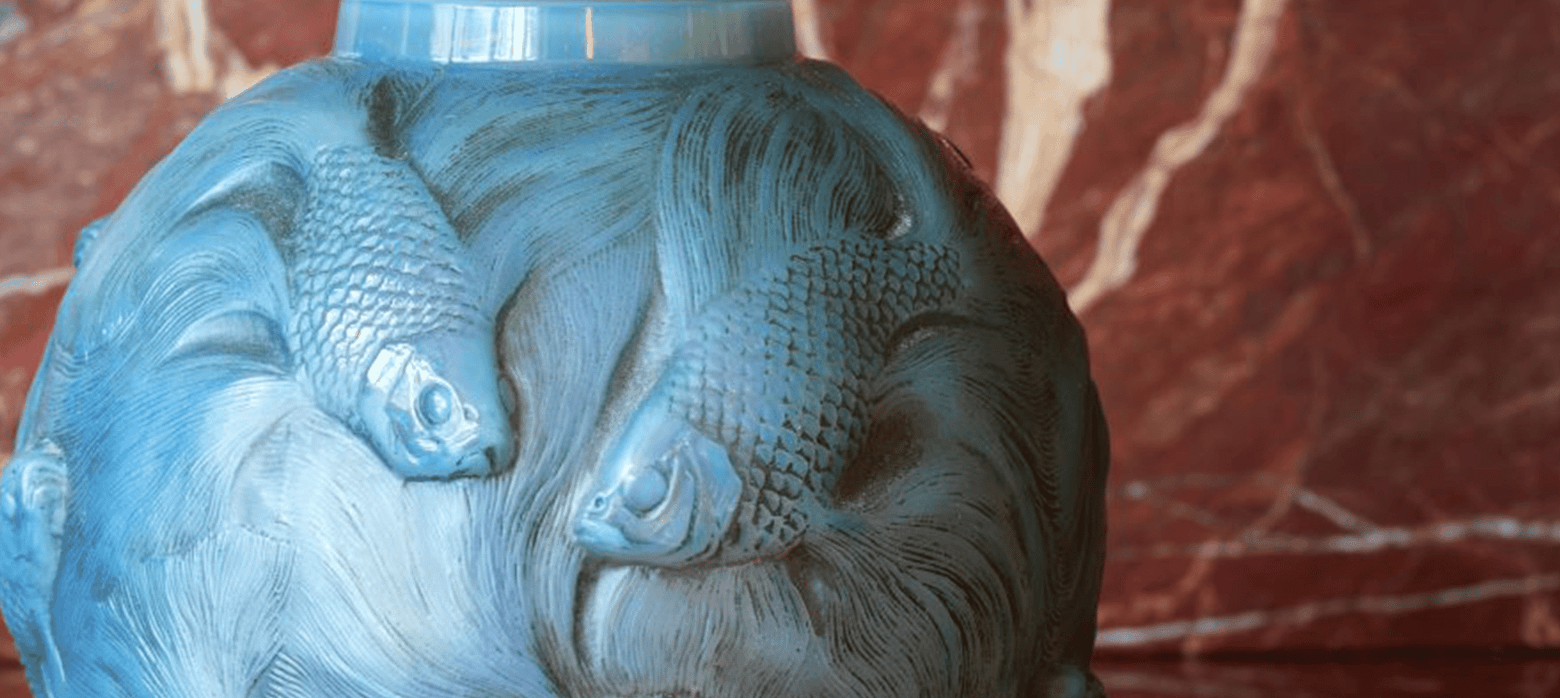 blue Lalique vase with fish on it