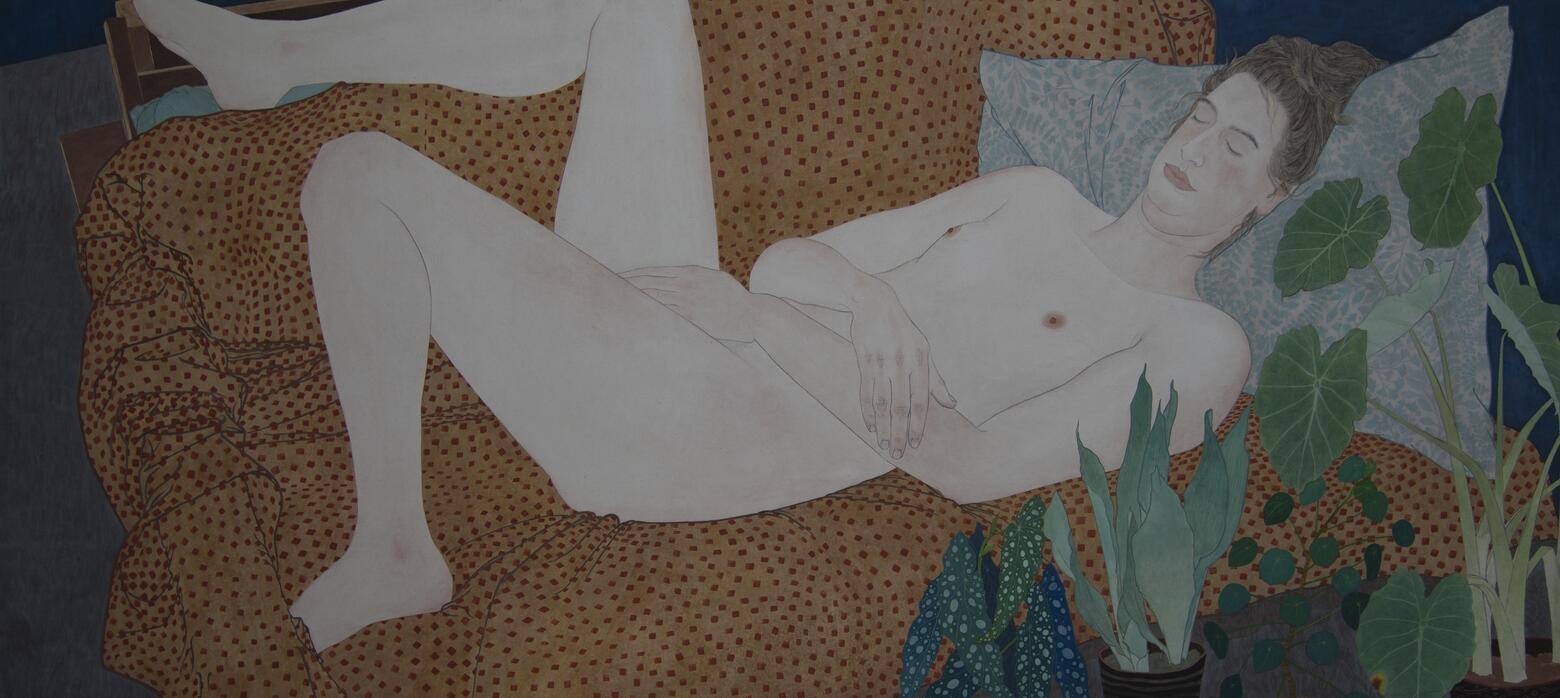 A nude portrait, lounging on a brown couch.