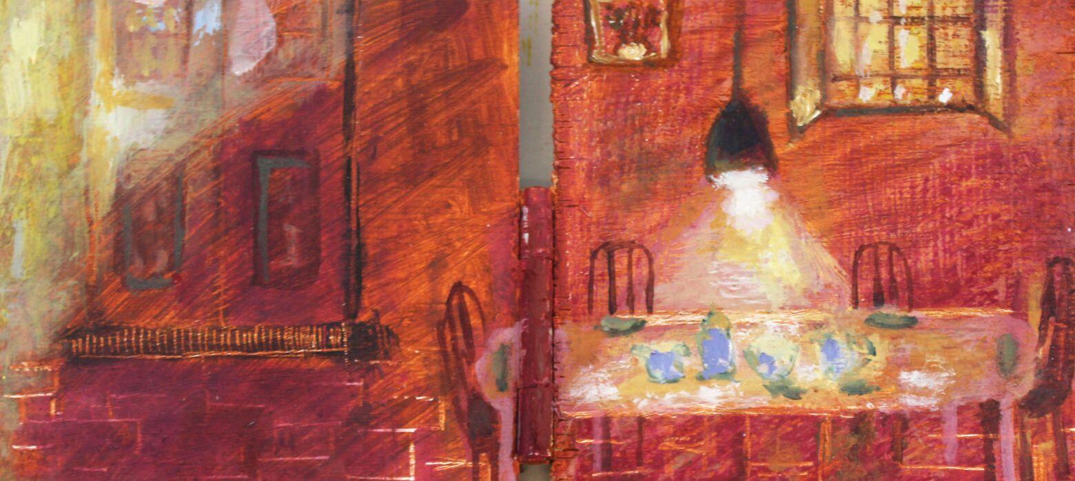 A dining table under a warm ceiling lamp