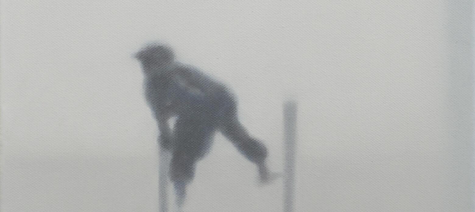 A figure moves through fog, or mist. 