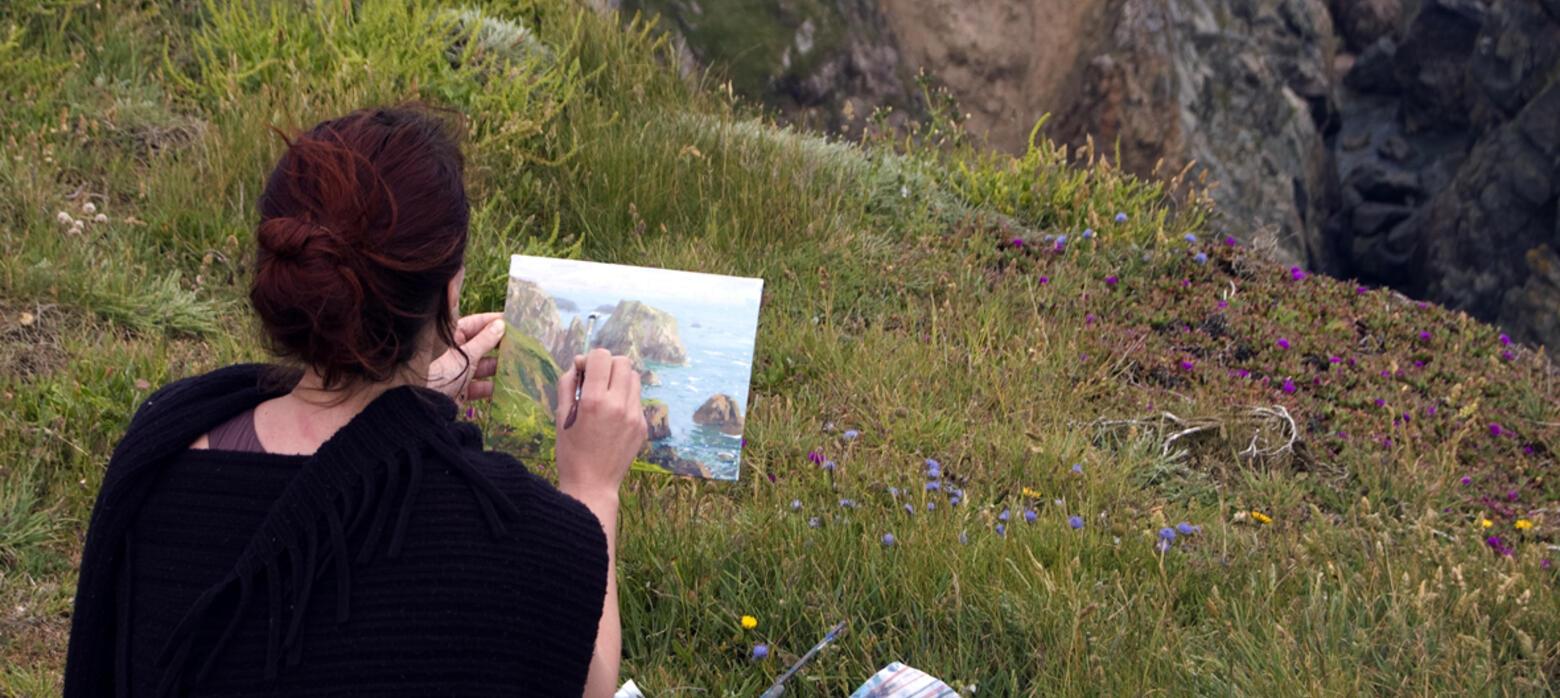 Jenny Aitken painting on cliff edge