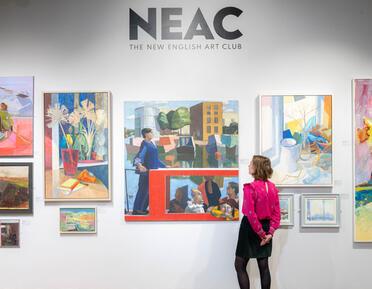 Installation shot of paintings on a wall