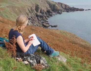 Amanda Bradbury sketching in the field