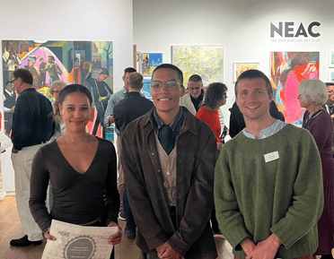 Three NEAC Scholarship winners with their certificates at the private view