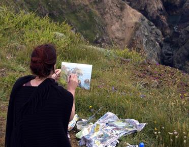 Jenny Aitken painting on cliff edge